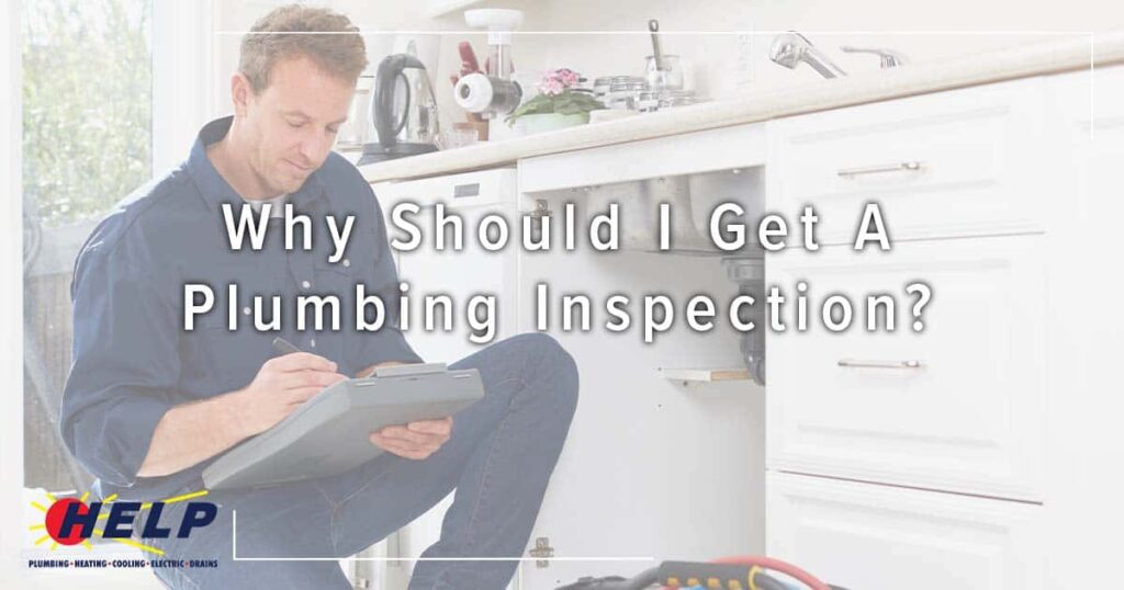 Man kneeling in a kitchen inspecting plumbing under the sink, taking notes on a clipboard. Text overlay reads, "Why Should I Get A Plumbing Inspection?" Logo in bottom left corner.