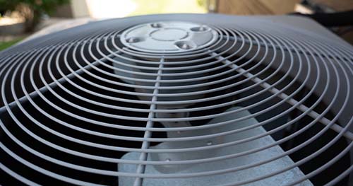 Image: closeup of a condenser fan. Carlisle air conditioning repairs are import for local homeowners.