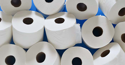 Image: toilet paper rolls with a blue background.