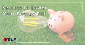 A piggy bank and coins sit beside a large lightbulb on the grass, with the intriguing message: "Discover Secrets to Lower Your Energy Bill.